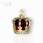 Gold crown with red velvet interior and green gemstones on a white background, branded 'Crowns & Regalia'.